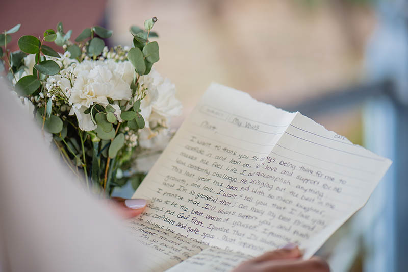 Brides wedding vows on paper