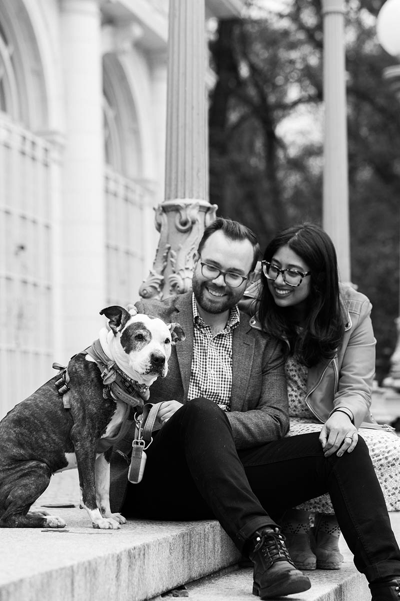 Black and white engagement portrait with dog