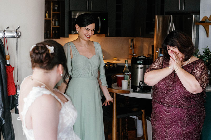 Mother of bride reaction after seeing daughter in wedding dress