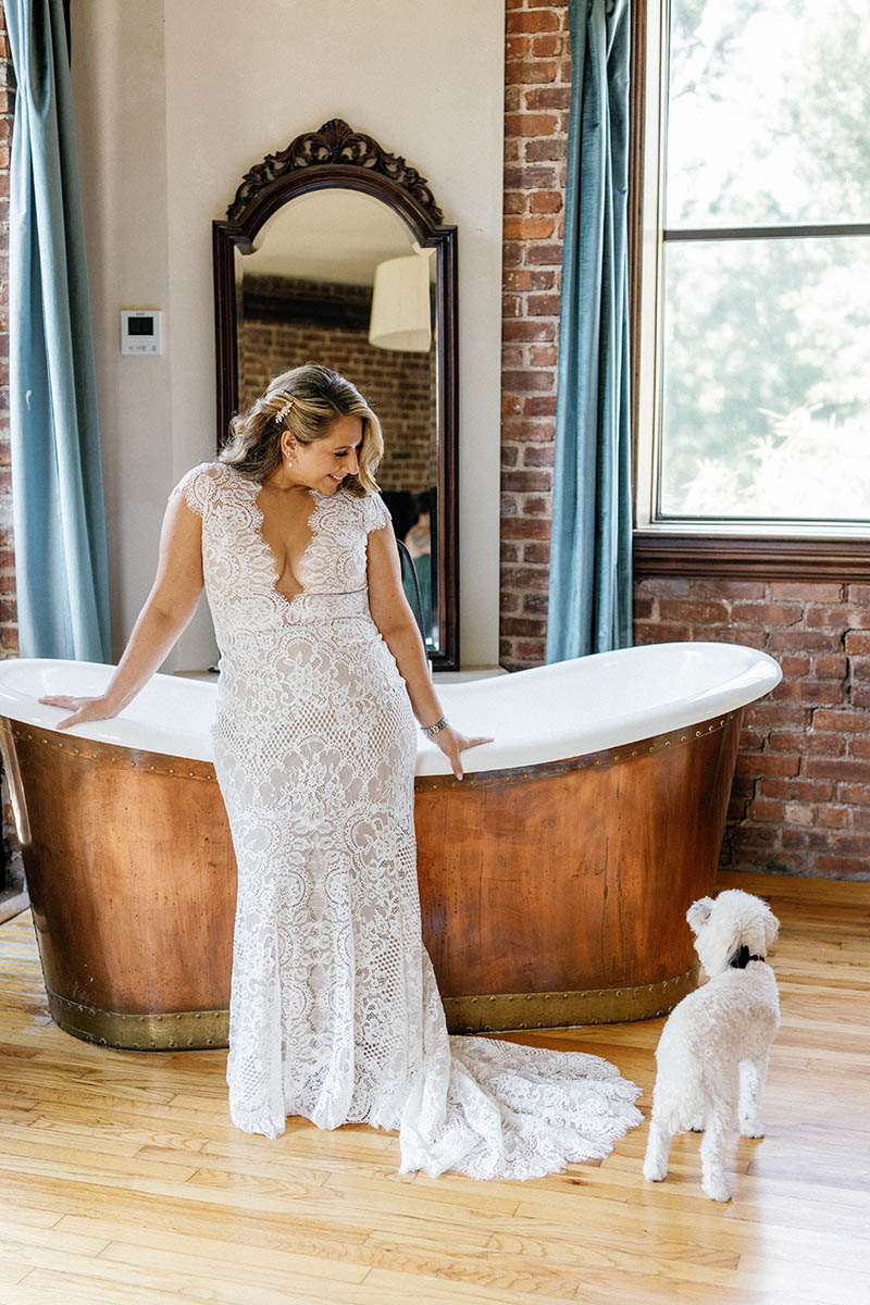 Bride looking at dog