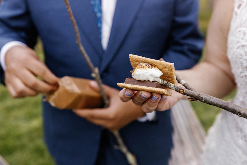 Bride and groom making smores