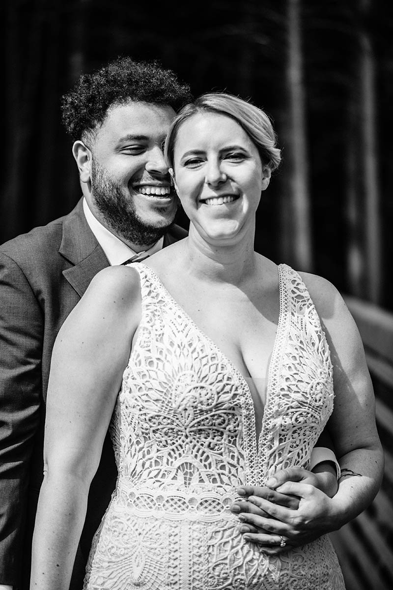 Black and white wedding portrait of interracial couple